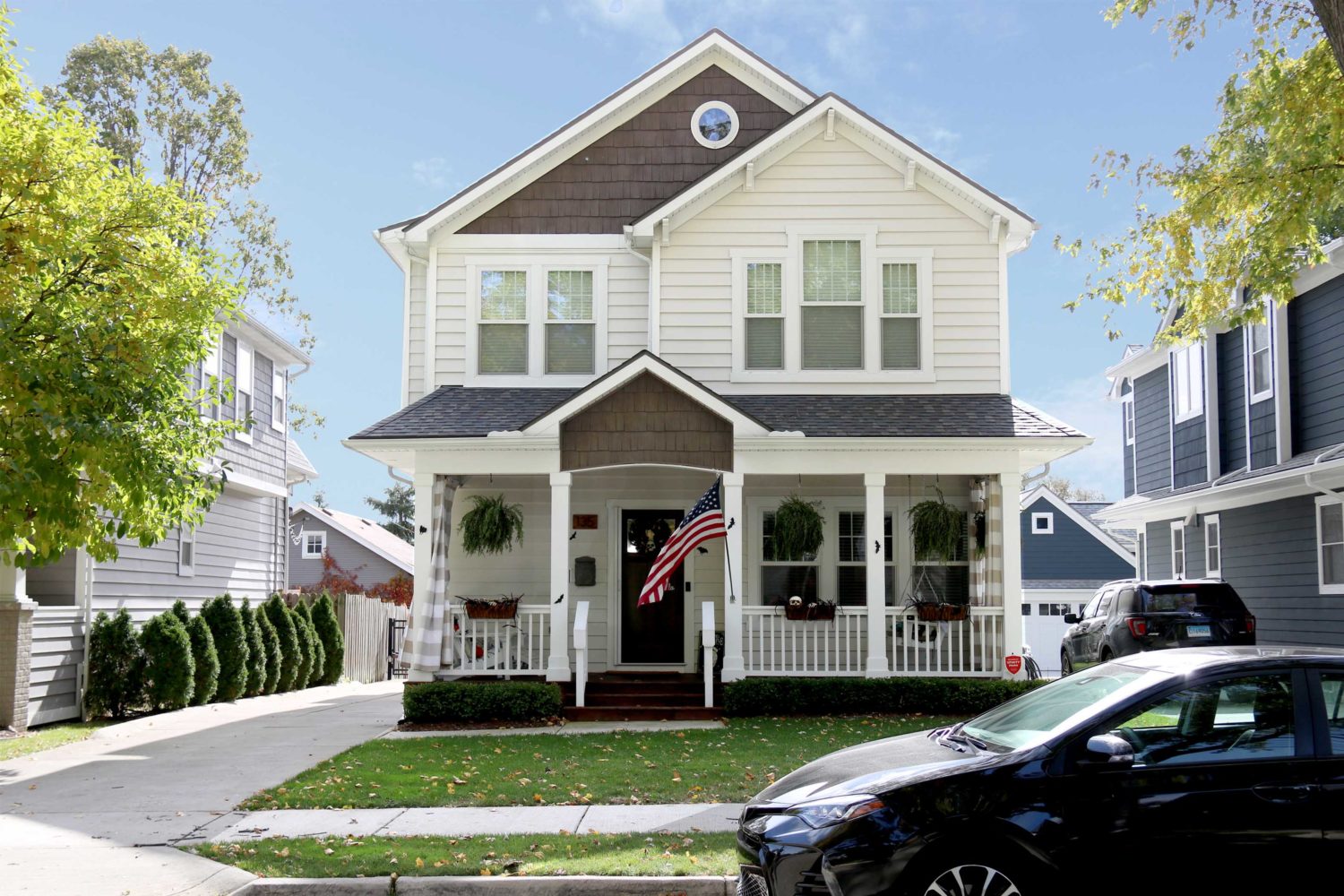 135 Albertson St.-White two-story house.