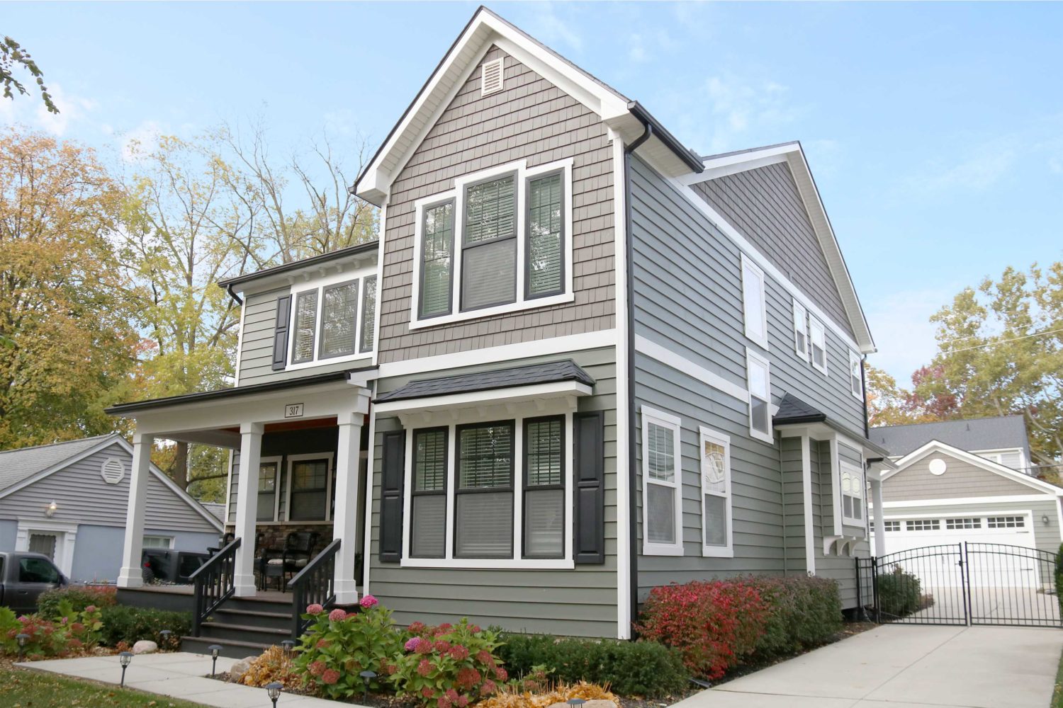317 Terry st-Modern gray home with black shutters.