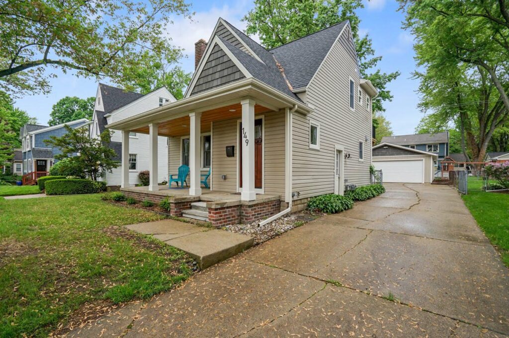 149 Linwood St.-Beige gabled cottage house.